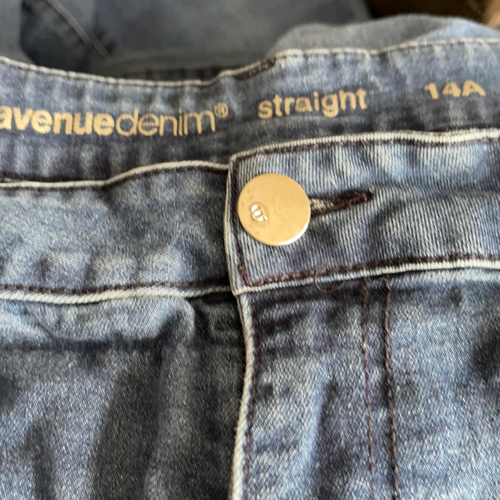Slight flaw in front blue jeans